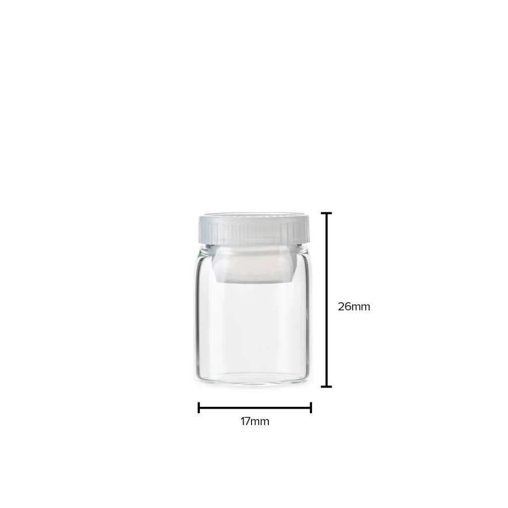 Small clear glass tube with plastic stopper for compact storage