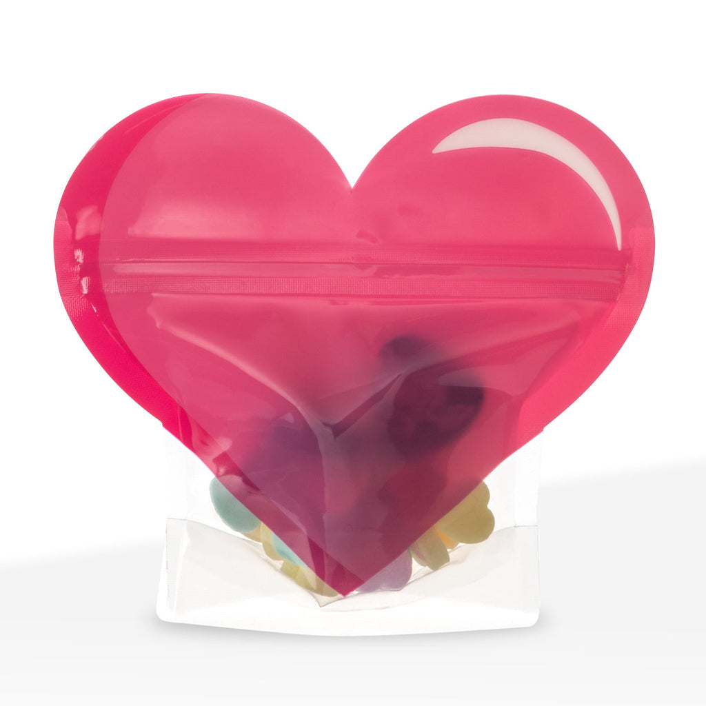 Flexible pink mylar pouch with printed heart graphics, compact size